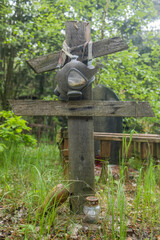Old Soviet military gas mask on a soldier's grave