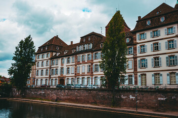 Old architectural building in the city of Strasburg and river. Cityscape