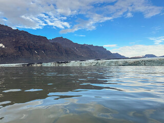 A view of the rugged terrain and tidewater glacier at Blosseville Coast in Greenland