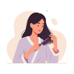 Young woman brushing her hair while wearing a bathrobe at home  