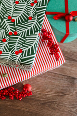Fototapeta premium Close-up of Christmas gifts with red berries