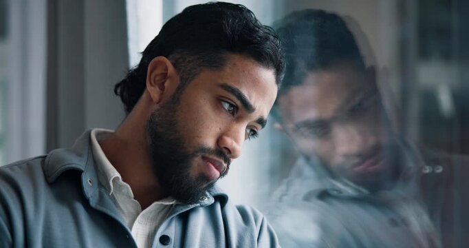 Sad, thinking and business man by glass with stress for failure, job loss and bankruptcy. Office, window and person with upset, disappointed and reflection for finance crisis, mistake or unemployment