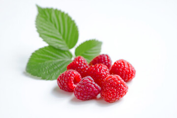 Raspberry with leaves isolated on white background