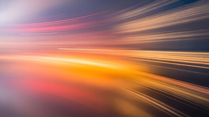 Naklejka premium Abstract motion blur of vibrant orange and yellow light trails streaking across a dark background at sunset or dusk