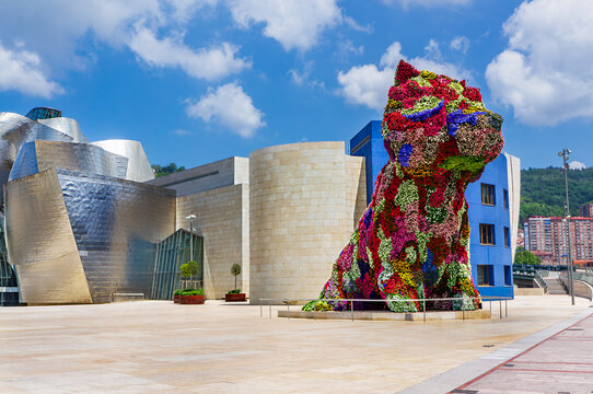 Bilbao, Spain-June 17, 2014: Jeff Koons' living plant sculptor of dog in front of the Guggenheim Museum of Contemporary Art of Bilbao. Located on the North Coast of Spain in the Basque region.