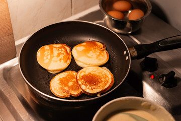 Homemade Apple Fritters Frying in a Skillet