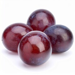 Close-up of four plump, glossy, dark red plums