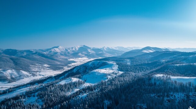 Winter nature panorama of far away blue mountains, picturesque view, aerial tonal perspective, monochrome photo of range mountains and blue sky,