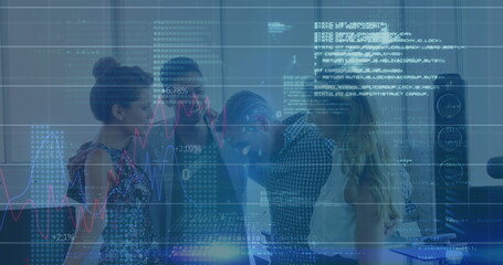 Collaborating professionals reviewing digital charts and code overlay at office desk, with monitors