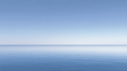 Obraz premium Calm ocean with gentle ripples under a clear blue sky, creating a serene and peaceful seascape.