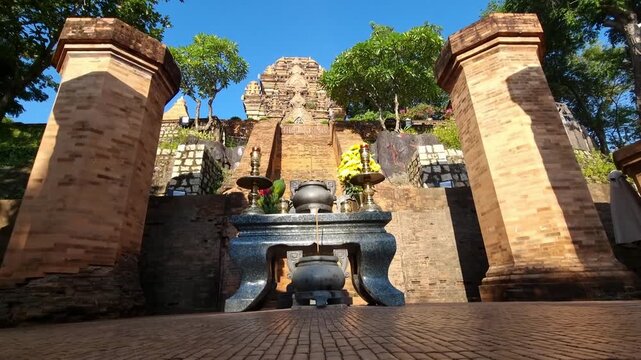 Po Nagar, Cham Temple Tower, Nha Trang in Vietnam. Ancient temple, historical and architectural landmark of Nha Trang. Incense smokes in foreground