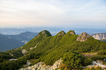 Scenic green mountain ridge in Tatra Mountains, Zakopane, Poland.
Panoramic view of green mountain ridge and rocky peaks in Tatra Mountains