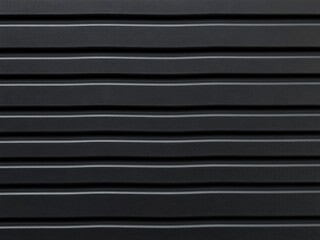 Obraz premium Close-Up of Matte Black Rubber Grip Texture – Industrial Non-Slip Surface for Automotive Parts, Electronics, Rugged Tools, or Tech Product Design Backgrounds in High-Resolution Macro Photography