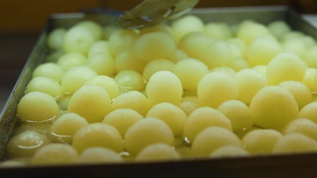Rasgulla an indian dessert white balls dipped in sugar syrup
