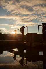 Canal lock gate on the Shropshire Union canal,. England, in early evening sunlight. Inland waterway...