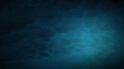 Fototapeta premium Abstract textured background with a gradient of deep blue to bright teal and subtle light effects