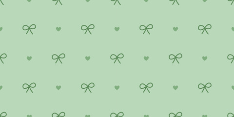 Seamless bow and heart pattern in pastel green