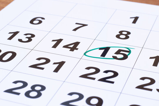 In calendar, number 15 circled and highlighted in the green color marker