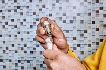 Compression coupling with threaded nut is positioned near end of multilayer pipe for installation to connect segments in household water supply system.