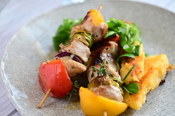 Colorful grilled chicken skewer with vibrant vegetables as a delicious food background. 