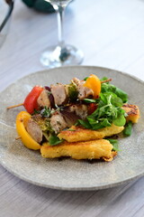Colorful grilled chicken skewer with vibrant vegetables as a delicious food background. 