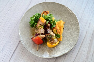 Colorful grilled chicken skewer with vibrant vegetables as a delicious food background. 