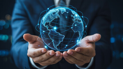 Businessman holding a glowing digital globe in his hands