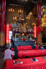 A visit to the Chua Van Phat Temple; Also known as the Temple of Ten Thousand Buddhas, the four-storied structure is often filled with incense smoke and offerings at the altar. 