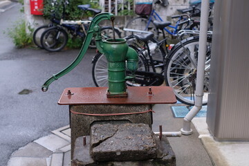 classical Japanese water well in the town