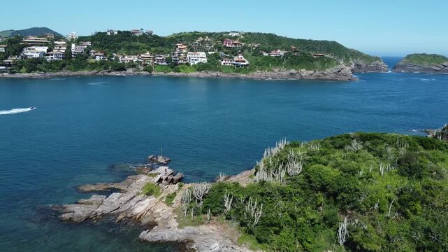 Summer Drone Flight over Ferradura Beach, B&uacute;zios, Brazil: A 2.7K Aerial View of Sunbathers, Boats, and Stunning Coastline