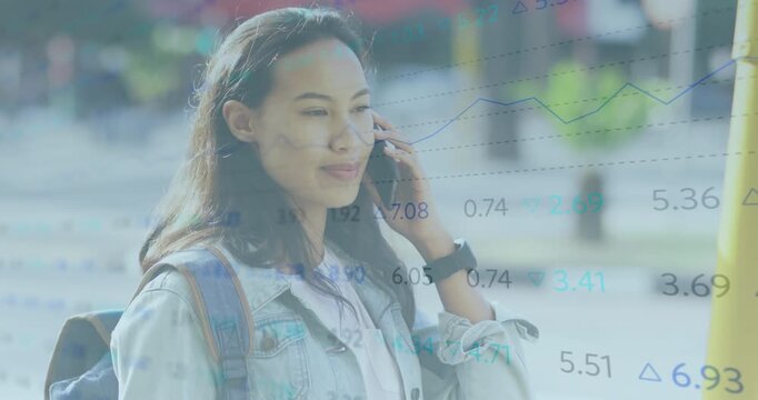 Woman answering call on sidewalk getting market news and smiling as animated graphs pulsing behind - Powered by Adobe