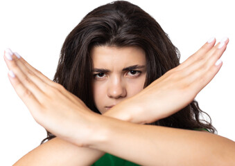 Fototapeta premium Portrait of a serious young woman showing stop gesture with her palm over white background
