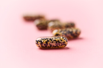 Iron capsules on bright background. Soft focus. Close up. Copy space.	