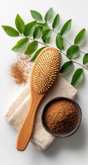 Natural hair care.  Wooden brush, powder, towel, leaves