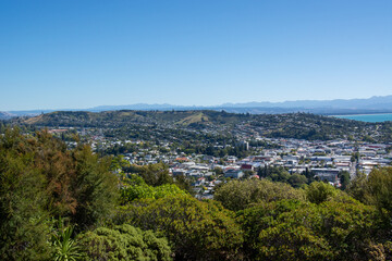 Panoramic City View with Hills and Water
