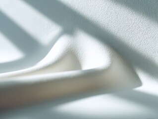 Minimalist background of a blurred white wall with subtle shadows, clean and simple. Copy space, elegant. Soft light.