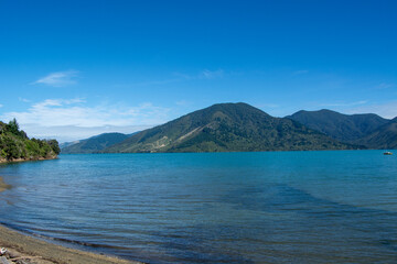 Serene Lake Surrounded by Mountains