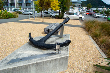Black Anchor Sculpture in Urban Landscape