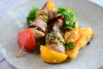 Grilled Chicken Skewer with Vegetables, Polenta and Fresh Greens