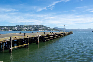 Obraz premium Serene Wooden Pier Over Calm Waters