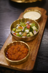 Traditional Indian Side Dishes with Raita, Pickle, and Salad