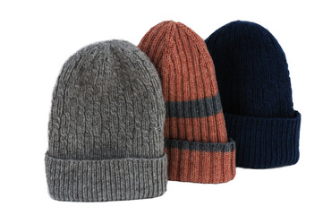 Knitted hats of three clovers, isolated on a white background. Hats without pompoms.