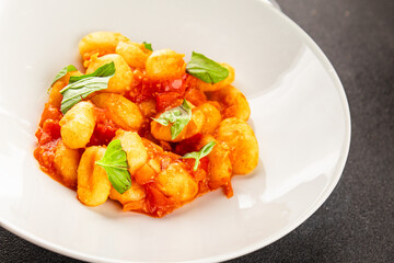 Gnocchi tomato sauce fresh delicious gourmet food background on the table  rustic food top view copy space