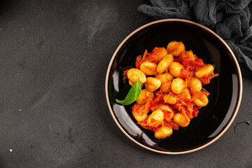 Gnocchi tomato sauce fresh delicious gourmet food background on the table  rustic food top view copy space