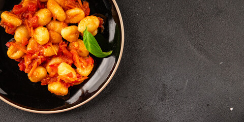 Gnocchi tomato sauce fresh delicious gourmet food background on the table  rustic food top view copy space
