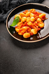 Gnocchi tomato sauce fresh delicious gourmet food background on the table  rustic food top view copy space