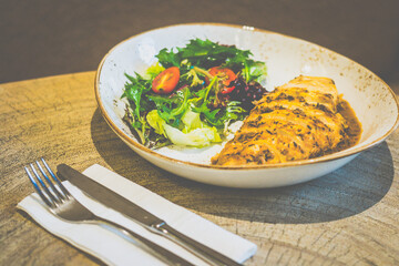 Cajun Chicken Steak with Black Pepper Sauce
Free-range chicken breast seared & roasted in house blend Cajun marination; black pepper sauce & side salad