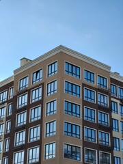 Modern high-rise building with large windows and roof
