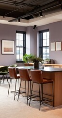 Fototapeta premium Modern, neutral-toned office kitchen area with a light wood countertop and dark brown leather bar stools