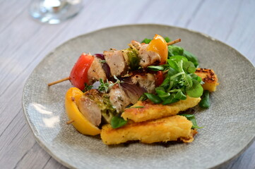 Colorful Lunch Dish with Chicken Skewer on Light Background